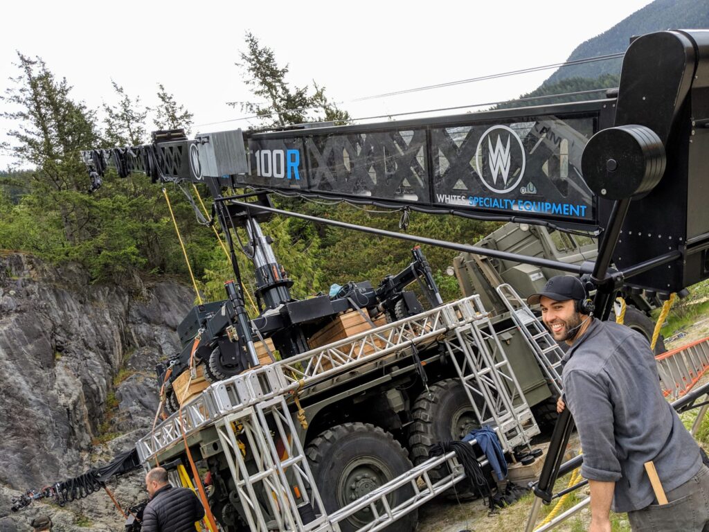 Camera crane and grip platform set up in a forested location